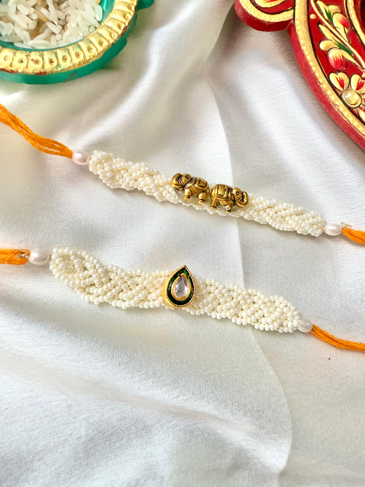 Set Of 2 Pearl Aura Rakhi Combo